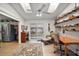 Bright bonus room featuring skylights, a ceiling fan, desk, and sliding glass doors at 20 Ginger Cir, Leesburg, FL 34748