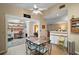 Open-concept eat-in kitchen featuring hardwood floors and views into multiple rooms at 20 Ginger Cir, Leesburg, FL 34748