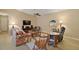 Cozy living room with hardwood floors, ceiling fan and comfortable seating arrangements at 20 Ginger Cir, Leesburg, FL 34748