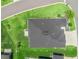 An aerial view showing the home's roof and the expansive backyard featuring a patio and BBQ area at 2006 Oppenheimer Ct, The Villages, FL 34762