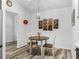 Cozy dining area with a round table, stylish light fixture, and tasteful wall decor at 2006 Oppenheimer Ct, The Villages, FL 34762