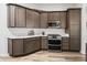 Well-equipped kitchen features stainless steel appliances, abundant cabinet space, and modern design elements at 2006 Oppenheimer Ct, The Villages, FL 34762