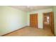 Bedroom with a closet and doorway, plus carpet flooring and ample light at 2112 Robie Ave, Mount Dora, FL 32757