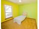 Cozy bedroom with a large window, carpet flooring, and neutral tones at 2112 Robie Ave, Mount Dora, FL 32757
