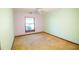 Neutral bedroom with a window offering natural light and carpet flooring at 2112 Robie Ave, Mount Dora, FL 32757