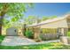 View of the side of the home featuring an air conditioning unit, detached garage, and brick exterior at 2112 Robie Ave, Mount Dora, FL 32757