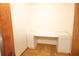 Bright home office area with a built-in desk and cabinet storage for organization at 2112 Robie Ave, Mount Dora, FL 32757