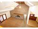 Spacious living room with a brick fireplace, high ceilings, skylights and natural light with carpeted floors at 2112 Robie Ave, Mount Dora, FL 32757