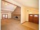 Open living room featuring a brick fireplace, ceiling fans, and double-door entry to a screened-in porch at 2112 Robie Ave, Mount Dora, FL 32757