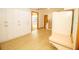 Spacious living room with plenty of storage cabinets and wood-look flooring at 2112 Robie Ave, Mount Dora, FL 32757