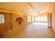 Brick sunroom with multiple windows offering an abundance of natural light and brick floor and wall at 2112 Robie Ave, Mount Dora, FL 32757