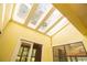 Bright sunroom featuring a skylight and multiple windows for natural light at 2112 Robie Ave, Mount Dora, FL 32757