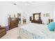 Bedroom featuring a walk-in closet and dresser with decorations at 21707 Queen Mary Ct, Leesburg, FL 34748