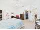 Bedroom featuring a walk-in closet and an open bathroom entryway at 21707 Queen Mary Ct, Leesburg, FL 34748