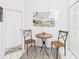 Cozy nook featuring a small wooden table with chairs and views of kitchen cabinets at 21707 Queen Mary Ct, Leesburg, FL 34748