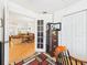 View of open-plan layout featuring living room and dining area with hardwood floors at 21707 Queen Mary Ct, Leesburg, FL 34748