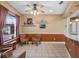 Cozy breakfast nook with window views and tile flooring next to the kitchen at 21815 Tartan St, Leesburg, FL 34748