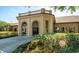 Exterior of clubhouse with stone accents, arches, and manicured landscaping and mature shrubbery at 21815 Tartan St, Leesburg, FL 34748
