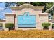 Royal Highlands Monarch Golf Club entrance sign featuring mature landscaping, shrubs, and colorful flowers at 21815 Tartan St, Leesburg, FL 34748