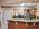 Bright kitchen featuring stainless steel appliances, tile backsplash, and modern lighting at 21815 Tartan St, Leesburg, FL 34748