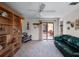Comfortable living room with a built-in bookcase and view to the screened patio at 21815 Tartan St, Leesburg, FL 34748