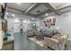 Inviting lobby area with seating, artwork, and a television for residents and guests at 21815 Tartan St, Leesburg, FL 34748