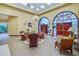 Lobby with tropical style furniture, tile flooring, and well lit with recessed lighting at 21815 Tartan St, Leesburg, FL 34748