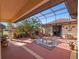 Outdoor patio with seating, plants, and a screened enclosure, perfect for entertaining at 21815 Tartan St, Leesburg, FL 34748