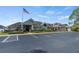 Community clubhouse with ample parking, lush landscaping, and a welcoming entrance, creating a social gathering spot at 236 Juniper Way, Tavares, FL 32778