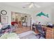 Inviting den that opens to a living area, creating a seamless transition between spaces, complete with neutral carpeting at 236 Juniper Way, Tavares, FL 32778