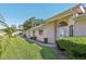 Well-manicured lawn and landscaping enhance this home's curb appeal at 236 Juniper Way, Tavares, FL 32778