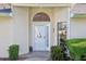 Beautiful front entrance with glass door and side window for natural light at 236 Juniper Way, Tavares, FL 32778