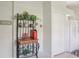 Charming kitchen display featuring a decorative baker's rack with plants and rustic decor next to a spacious closet at 236 Juniper Way, Tavares, FL 32778
