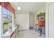 Sunlit kitchen nook with a window, white cabinets, and tiled floors, offering a cozy space for casual dining at 236 Juniper Way, Tavares, FL 32778