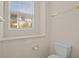 Bright bathroom features white fixtures and a window with natural light at 26207 Avenida Las Colinas # 26207, Howey In The Hills, FL 34737