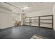 Spacious garage with overhead lighting, shelving, and storage for organization at 26207 Avenida Las Colinas # 26207, Howey In The Hills, FL 34737