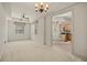 Spacious living room with large windows, and easy access to the kitchen and dining area at 26207 Avenida Las Colinas # 26207, Howey In The Hills, FL 34737