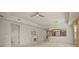 Open-concept living room featuring neutral walls, plush carpeting, and a cozy fireplace at 26207 Avenida Las Colinas # 26207, Howey In The Hills, FL 34737