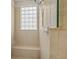 Close-up of a walk-in shower with a glass block window and tiled bench at 26207 Avenida Las Colinas # 26207, Howey In The Hills, FL 34737