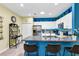 Modern kitchen featuring granite countertops, white cabinets, and stainless steel appliances at 26951 White Plains Way, Leesburg, FL 34748