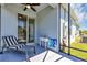 Screened-in lanai featuring patio furniture and view of the backyard at 27018 White Plains Way, Leesburg, FL 34748