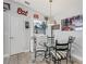 Dining area with seating for four with a laundry closet in the background at 2729 Craven Way, The Villages, FL 32162