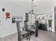 Elegant dining area featuring a modern glass table, stylish chairs, and contemporary decor creating an inviting space at 2729 Craven Way, The Villages, FL 32162