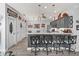 Kitchen breakfast bar and updated cabinets and lighting with wood look floors at 2729 Craven Way, The Villages, FL 32162