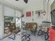 Inviting sunroom featuring colorful decor, comfortable seating, and ample natural light for relaxation at 2729 Craven Way, The Villages, FL 32162