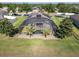 Aerial view of a home with a screened-in pool and lush backyard at 274 Giovani Blvd, Clermont, FL 34715
