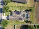 Overhead view of a home with solar panels and screened-in pool, surrounded by a lush green lawn at 274 Giovani Blvd, Clermont, FL 34715