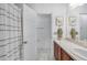 Well-lit bathroom with single sink vanity, framed mirror, and shower-tub combination at 274 Giovani Blvd, Clermont, FL 34715