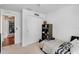 Bedroom with neutral carpet, ceiling fan, and connecting view to the main living space at 274 Giovani Blvd, Clermont, FL 34715