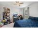 Cozy bedroom with ceiling fan, window, and carpet flooring, perfect for relaxing and resting at 274 Giovani Blvd, Clermont, FL 34715